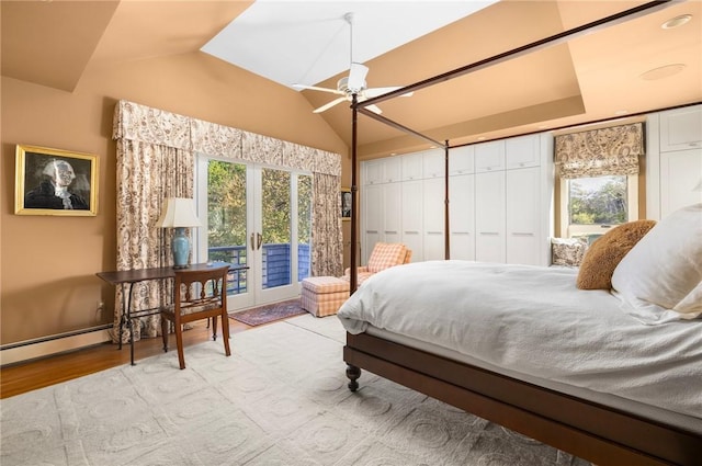 11 Mill Brook Ct, Charlestown, RI 02813 - bedroom featuring access to exterior, multiple windows, vaulted ceiling, wood finished floors, and a baseboard heating unit