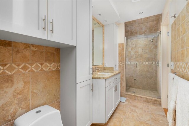 11 Mill Brook Ct, Charlestown, RI 02813 - bathroom with a shower stall, vanity, a freestanding bath, and tile walls