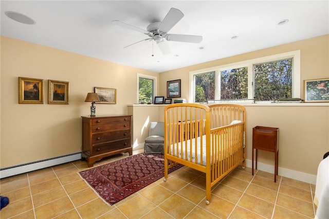 11 Mill Brook Ct, Charlestown, RI 02813 - tiled bedroom with a baseboard heating unit and baseboards