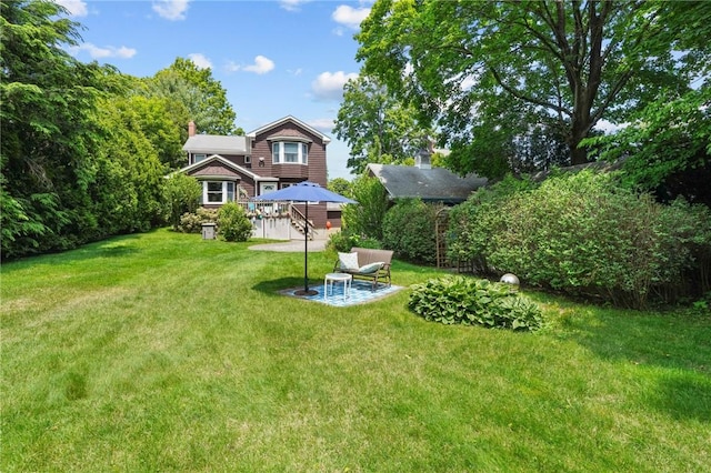 112 County Rd, Barrington, RI 02806 - view of green lawn with a patio area and a wooden deck
