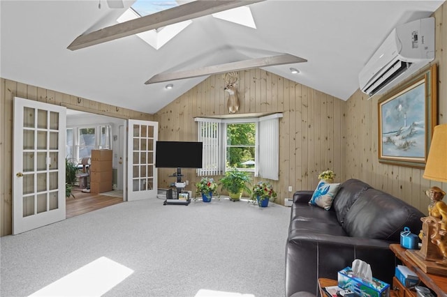 112 County Rd, Barrington, RI 02806 - living area with a skylight, lofted ceiling, french doors, a wall mounted air conditioner, and wooden walls