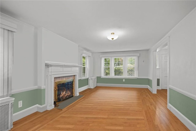 112 County Rd, Barrington, RI 02806 - unfurnished living room with a glass covered fireplace and light wood-style floors