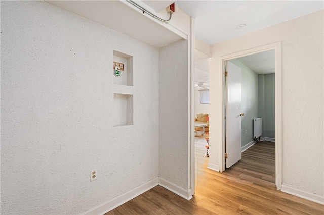 401 Bellevue Ave Unit 100, Newport, RI 02840 - corridor with wood finished floors and radiator