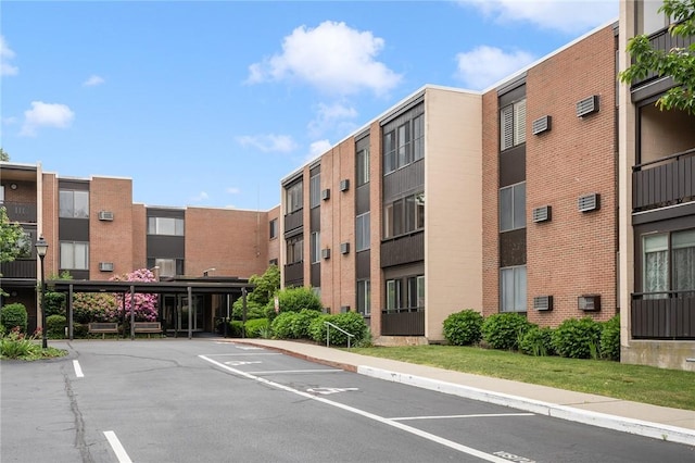 401 Bellevue Ave Unit 100, Newport, RI 02840 - view of apartment building / complex featuring uncovered parking