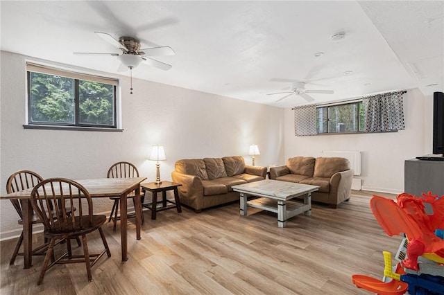 401 Bellevue Ave Unit 100, Newport, RI 02840 - living room with a ceiling fan, light wood finished floors, and radiator