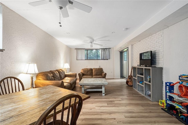 401 Bellevue Ave Unit 100, Newport, RI 02840 - living area featuring a textured wall, ceiling fan, and light wood finished floors