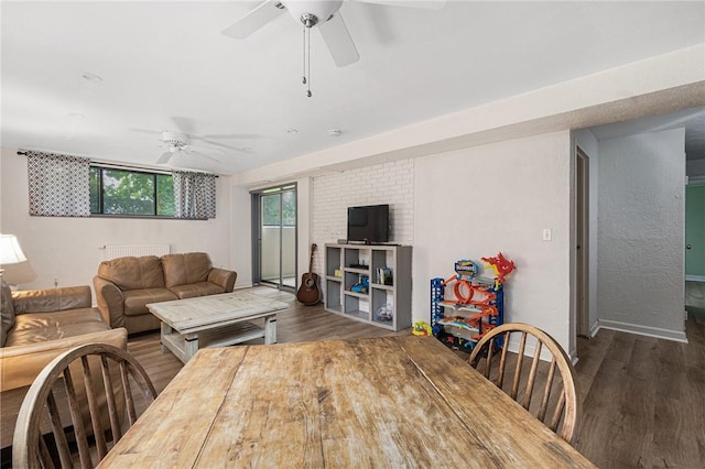401 Bellevue Ave Unit 100, Newport, RI 02840 - living area featuring a ceiling fan, wood finished floors, and radiator heating unit