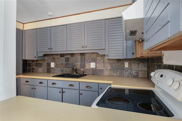 401 Bellevue Ave Unit 100, Newport, RI 02840 - kitchen with white electric stove, gray cabinetry, backsplash, and light countertops