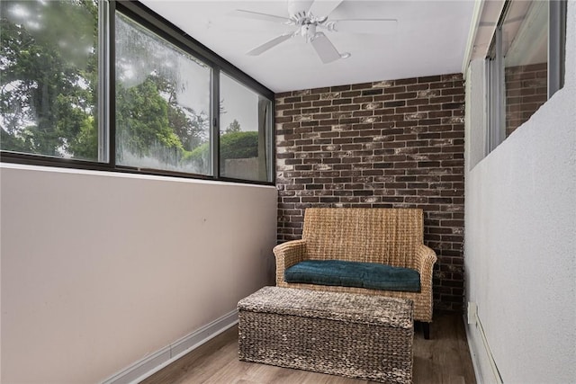 401 Bellevue Ave Unit 100, Newport, RI 02840 - sitting room with wood finished floors and ceiling fan