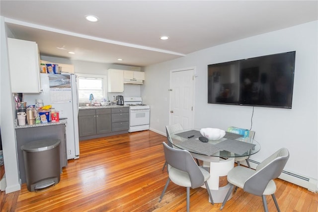 201 Hillcrest Ave, Providence, RI 02909 - dining space with a baseboard heating unit, light wood finished floors, and recessed lighting