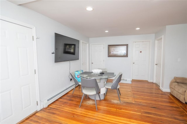 201 Hillcrest Ave, Providence, RI 02909 - dining area with a baseboard heating unit, light wood finished floors, and recessed lighting