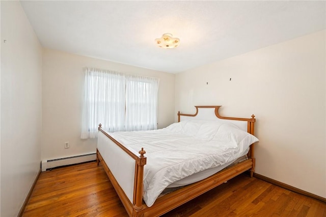 253 Nelson St, Providence, RI 02908 - bedroom with baseboard heating and wood finished floors