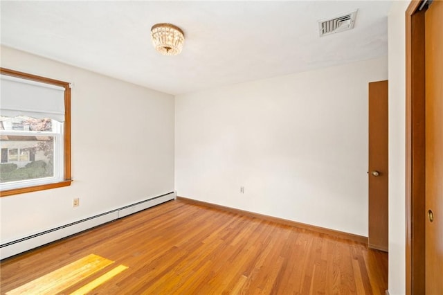 253 Nelson St, Providence, RI 02908 - spare room with a baseboard radiator and light wood finished floors