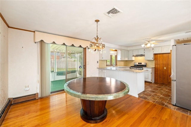 253 Nelson St, Providence, RI 02908 - dining room featuring a chandelier, light wood-style flooring, a ceiling fan, crown molding, and baseboard heating