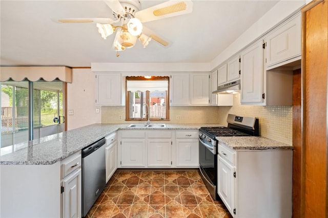 253 Nelson St, Providence, RI 02908 - kitchen featuring stainless steel appliances, a peninsula, ceiling fan, under cabinet range hood, and tasteful backsplash
