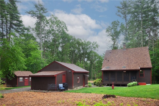 536 Douglas Hook Rd, Glocester, RI 02814 - view of property exterior with a sunroom, a lawn, a chimney, and an outdoor structure