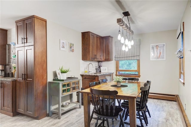 536 Douglas Hook Rd, Glocester, RI 02814 - dining room featuring light wood-style flooring and a baseboard radiator