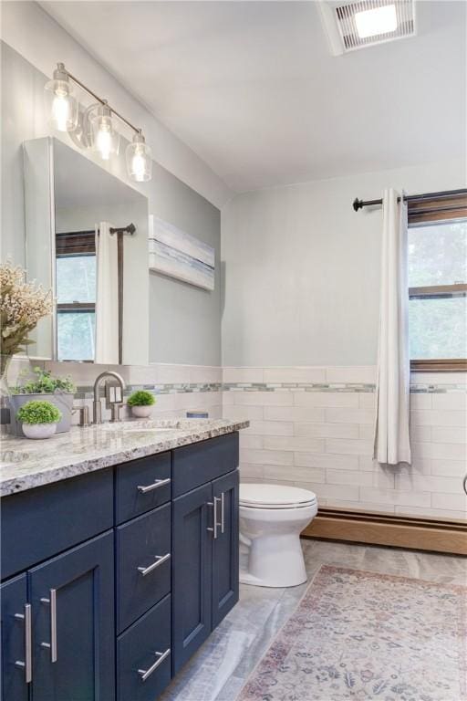 536 Douglas Hook Rd, Glocester, RI 02814 - full bathroom with a baseboard heating unit, vanity, tile walls, a wainscoted wall, and marble finish flooring