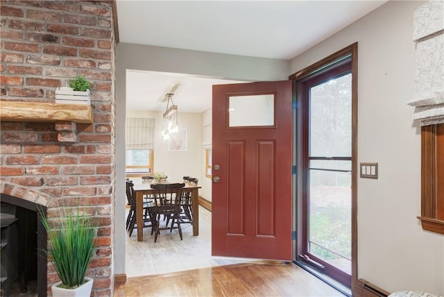 536 Douglas Hook Rd, Glocester, RI 02814 - entrance foyer with wood finished floors and a chandelier
