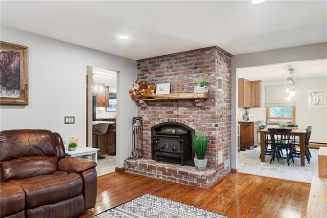 536 Douglas Hook Rd, Glocester, RI 02814 - living room featuring wood finished floors, recessed lighting, and a wood stove