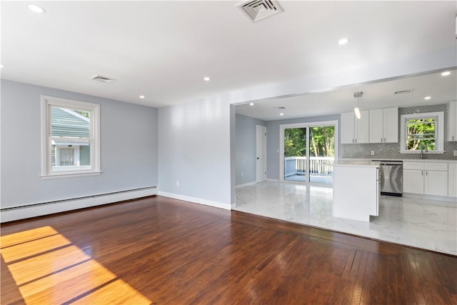 57 Wilson Ave, Johnston, RI 02919 - unfurnished living room with a baseboard radiator, light wood-type flooring, and recessed lighting