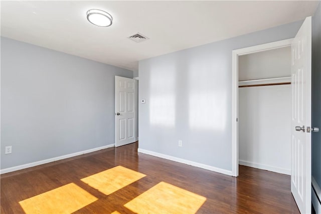 57 Wilson Ave, Johnston, RI 02919 - unfurnished bedroom with wood finished floors and a closet
