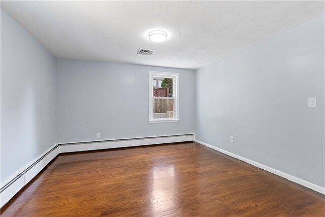 57 Wilson Ave, Johnston, RI 02919 - unfurnished room featuring a baseboard radiator and wood finished floors