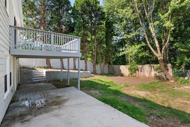 57 Wilson Ave, Johnston, RI 02919 - fenced backyard with a patio area and a deck