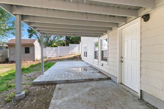57 Wilson Ave, Johnston, RI 02919 - view of patio / terrace featuring a storage unit