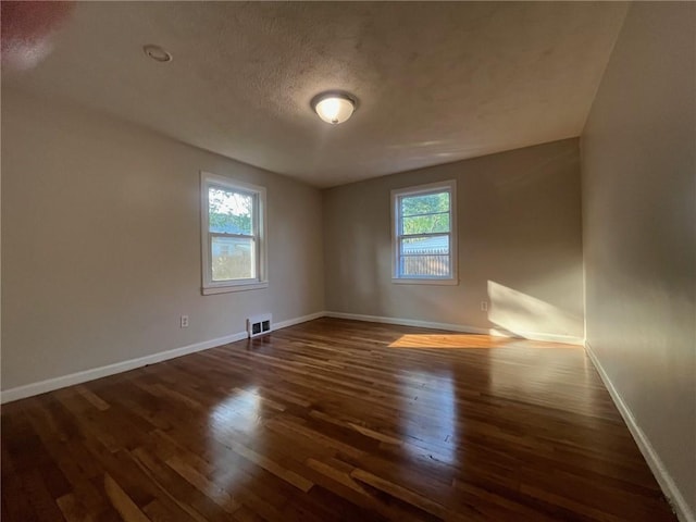 100 Kenneth Ave, Warwick, RI 02889 - empty room with wood finished floors and a textured ceiling
