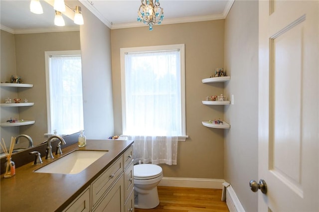 21 Carpenter Ave, Barrington, RI 02806 - bathroom featuring vanity, wood finished floors, ornamental molding, and plenty of natural light