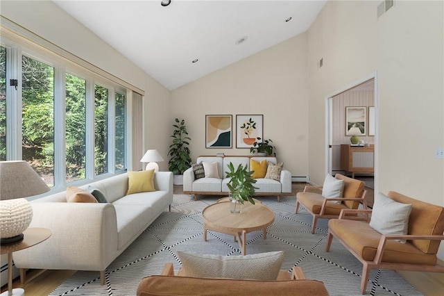 9 Beacon Hill Dr, Warwick, RI 02886 - living room featuring high vaulted ceiling, a baseboard radiator, and wood finished floors