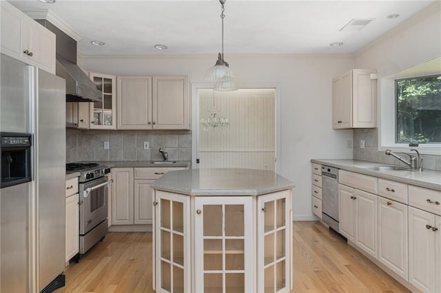 9 Beacon Hill Dr, Warwick, RI 02886 - kitchen with stainless steel appliances, light wood finished floors, decorative backsplash, glass insert cabinets, and crown molding