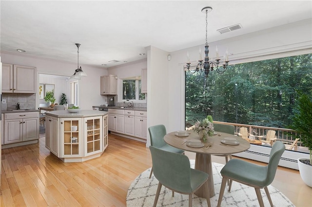 9 Beacon Hill Dr, Warwick, RI 02886 - dining space featuring a chandelier and light wood-type flooring