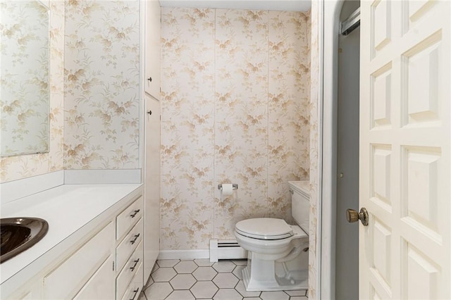 9 Beacon Hill Dr, Warwick, RI 02886 - bathroom featuring baseboard heating, tile patterned flooring, and vanity