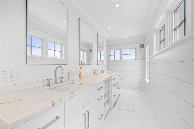 1210 Graces Cove Rd, Block Island, RI 02807 - bathroom with plenty of natural light, double vanity, ornamental molding, and tile patterned floors