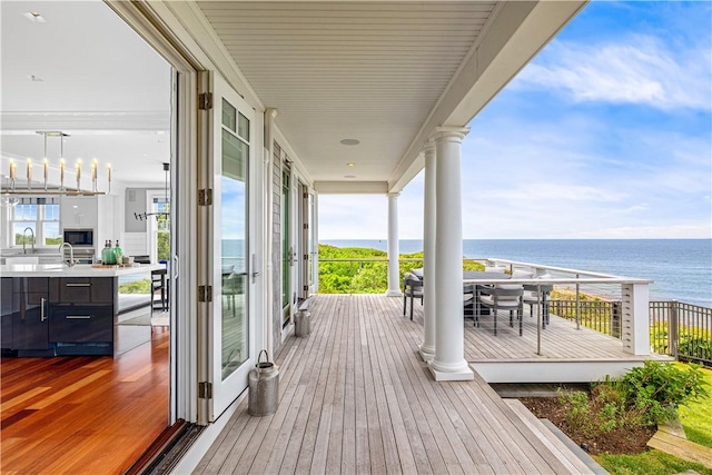 1210 Graces Cove Rd, Block Island, RI 02807 - wooden deck with a water view and a sink