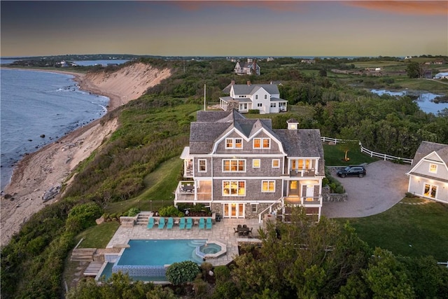 1210 Graces Cove Rd, Block Island, RI 02807 - aerial view at dusk of a water view and view of pool area