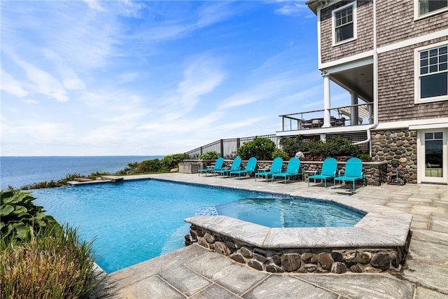 1210 Graces Cove Rd, Block Island, RI 02807 - view of pool with a pool with connected hot tub, a patio, and a water view