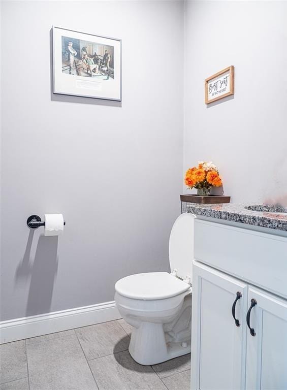 19 Revere Ave, West Warwick, RI 02893 - half bathroom featuring vanity and tile patterned flooring