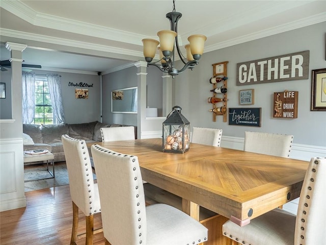19 Revere Ave, West Warwick, RI 02893 - dining room featuring a chandelier, crown molding, wood finished floors, and ornate columns