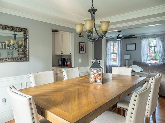 19 Revere Ave, West Warwick, RI 02893 - dining space with a chandelier, crown molding, wainscoting, and dark wood-style floors