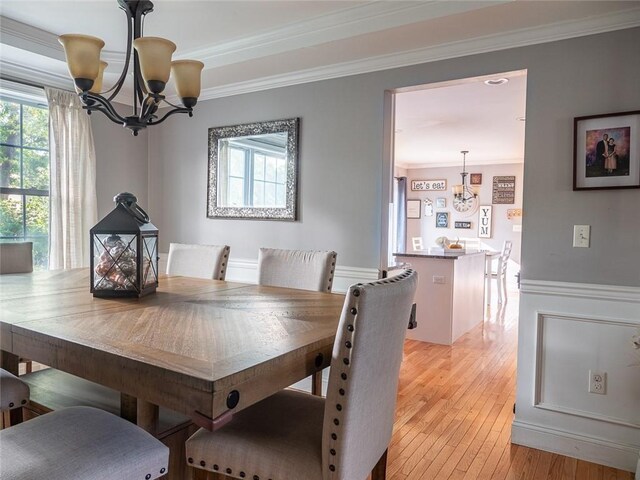 19 Revere Ave, West Warwick, RI 02893 - dining area with a chandelier, ornamental molding, and light wood finished floors