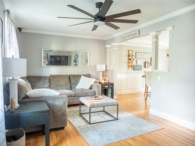 19 Revere Ave, West Warwick, RI 02893 - living area featuring a ceiling fan, wood finished floors, ornamental molding, and decorative columns