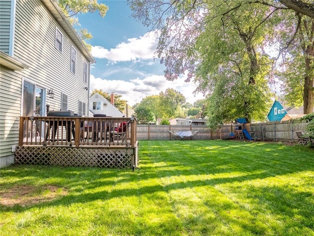 19 Revere Ave, West Warwick, RI 02893 - fenced backyard featuring a playground and a wooden deck