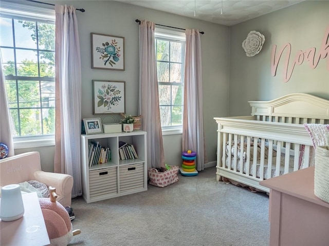 19 Revere Ave, West Warwick, RI 02893 - carpeted bedroom with a crib