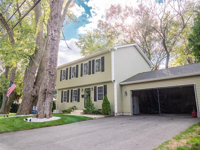 19 Revere Ave, West Warwick, RI 02893 - colonial house featuring a garage and asphalt driveway