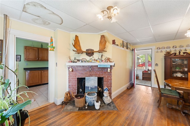 49 Palmer Ave, Warwick, RI 02889 - living room with light wood-style flooring and a fireplace