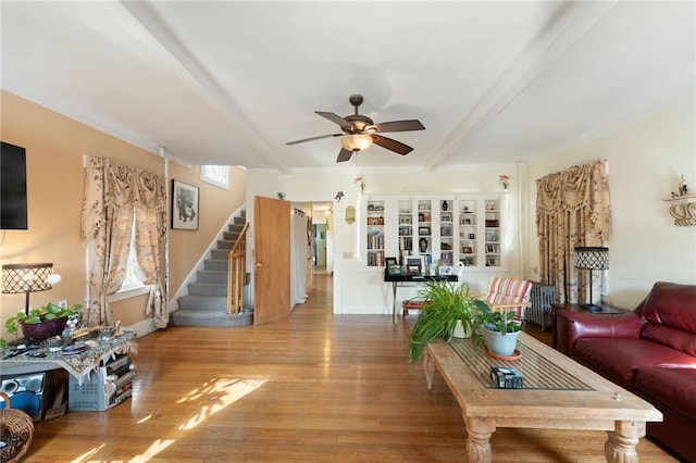 49 Palmer Ave, Warwick, RI 02889 - living area with stairway, ceiling fan, beamed ceiling, radiator, and wood finished floors