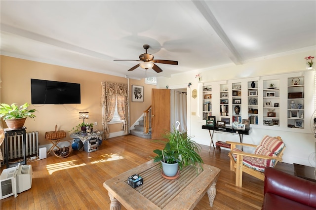 49 Palmer Ave, Warwick, RI 02889 - living area featuring ceiling fan, radiator, stairs, wood-type flooring, and beamed ceiling